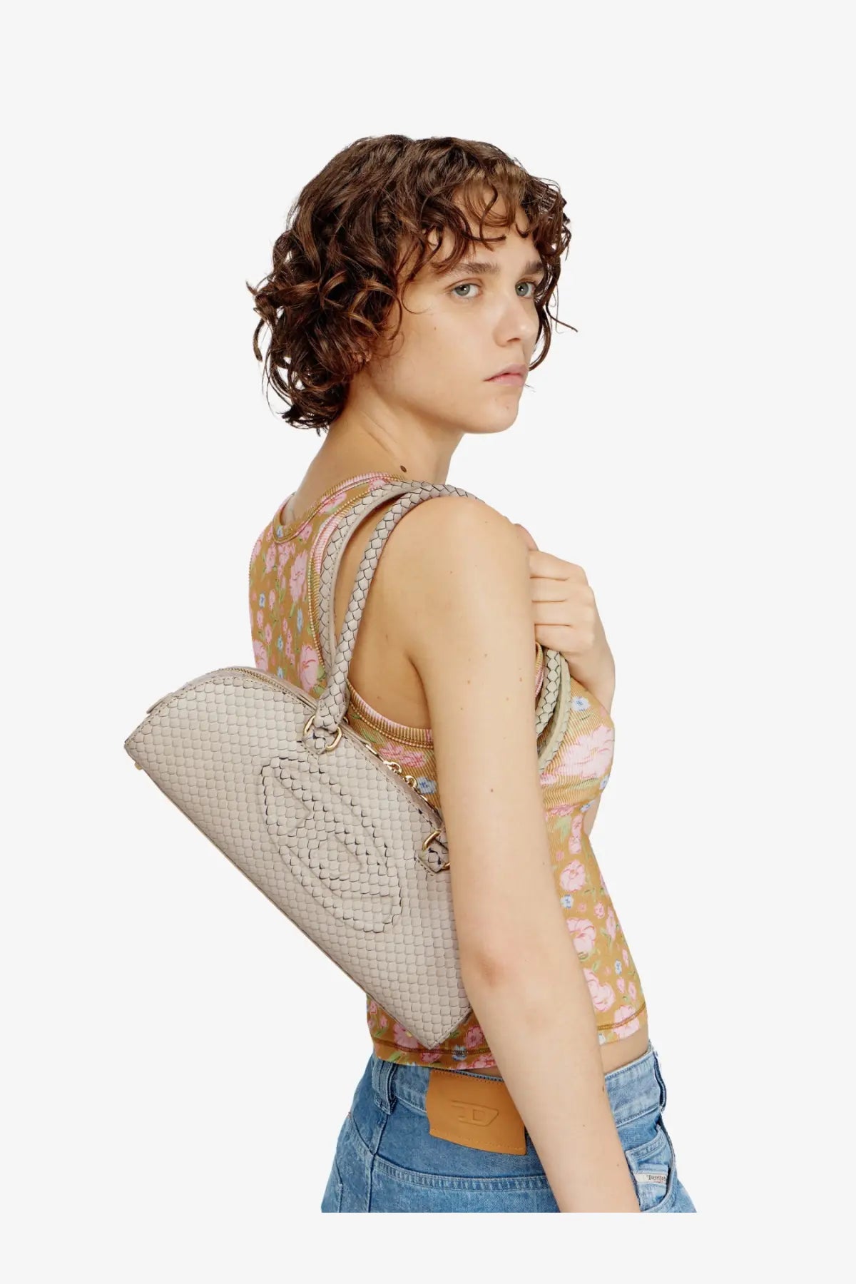 Beige woven leather diesel women’s python effect shoulder bag with quilted texture and braided strap