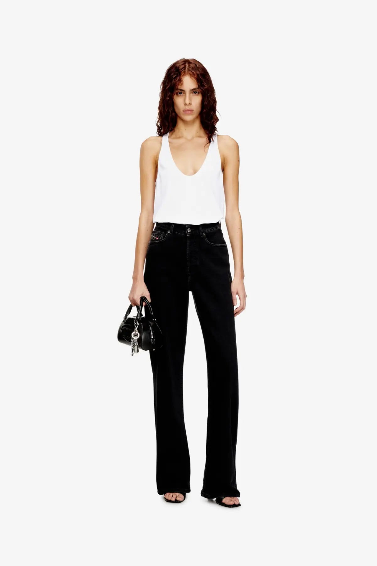 Black high-waisted flared denim jeans with classic five-pocket design and visible stitching paired with diesel white ribbed cotton tank top
