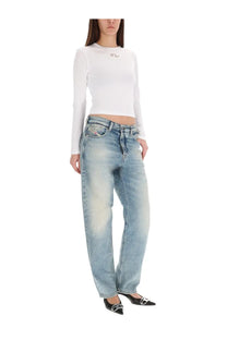 Diesel women’s shirt uncutie long white paired with light-wash denim jeans featuring a relaxed fit and five-pocket design