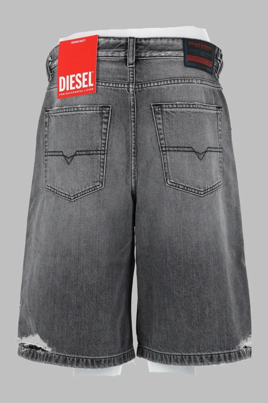 Grey distressed denim shorts with black stitching and red diesel brand tag for women in denim grey