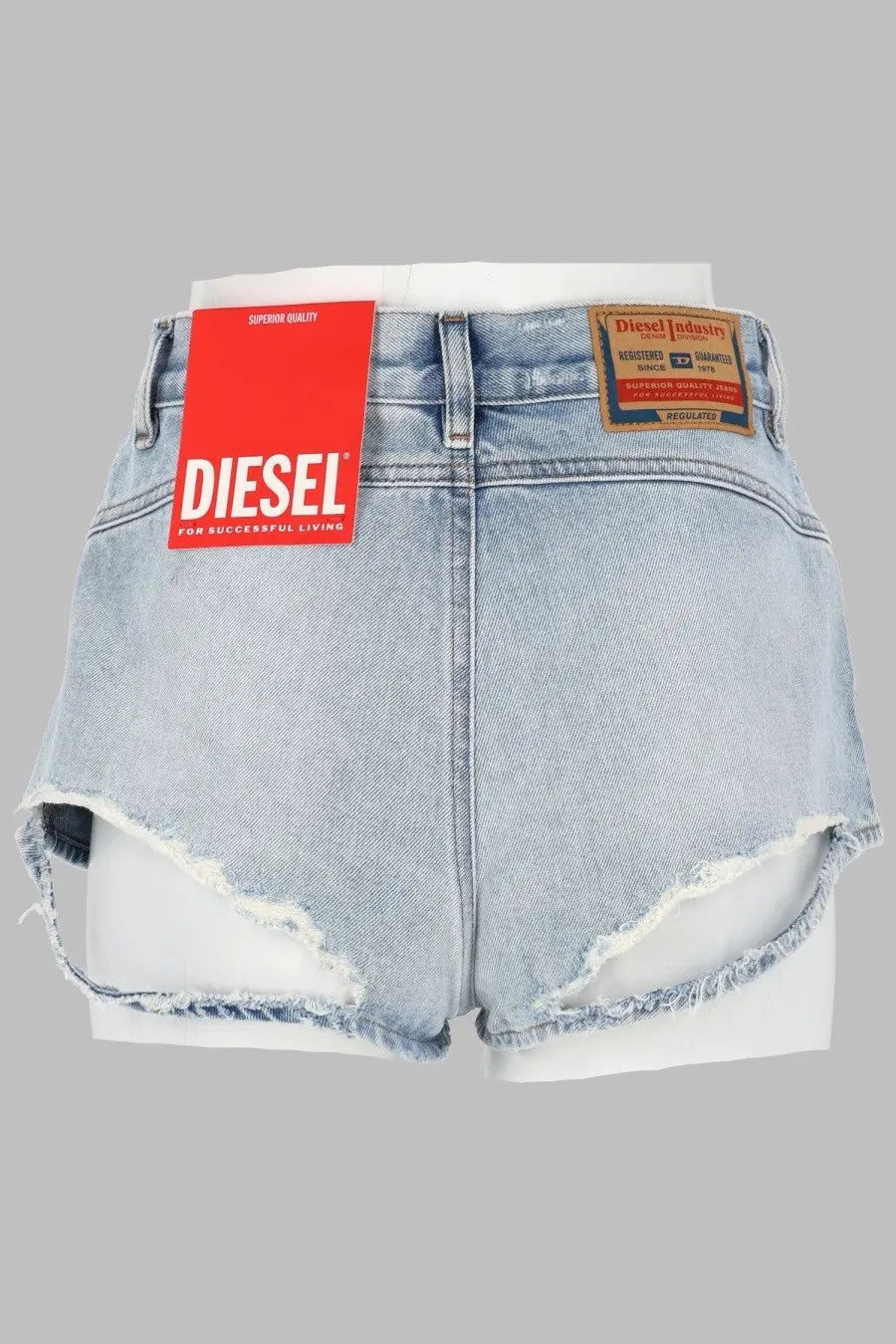 Diesel women’s light-wash denim shorts with frayed hem and red diesel brand tag in blue