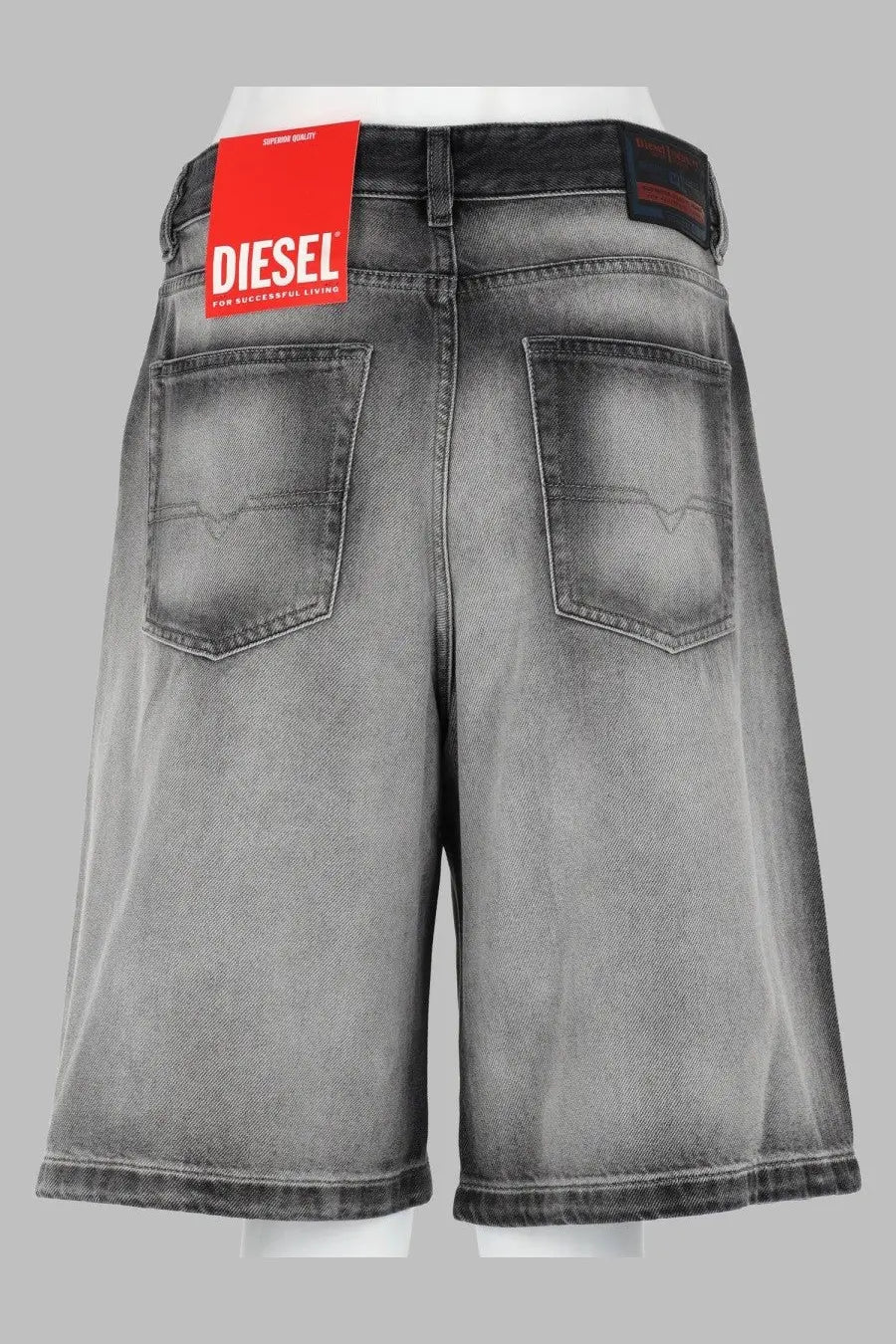 Diesel women’s shorts in skeleton grey distressed denim with a red diesel brand tag on the waistband