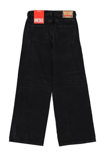 Diesel women’s sire jeans black wide-leg denim with faded wash and red diesel brand tag at the waistband