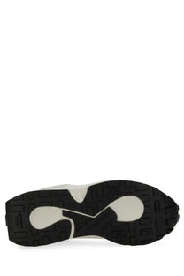 Black and white rubber sole with wave pattern of diesel women’s sneaker runner tame white shown from back side