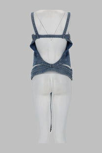 Blue denim crop top with adjustable straps and back cutout design shown from the back by diesel women