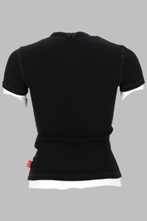 Diesel women’s black jersey top with white trim on sleeves and hem featuring a small red brand tag at bottom left