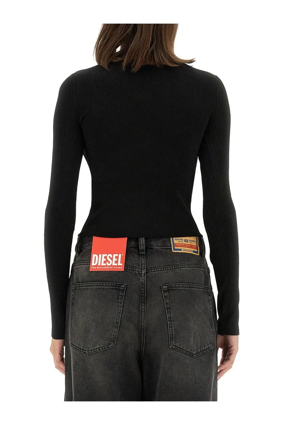 Back side of diesel womens top valari black showing ribbed long sleeve high neckline and diesel label on waistband