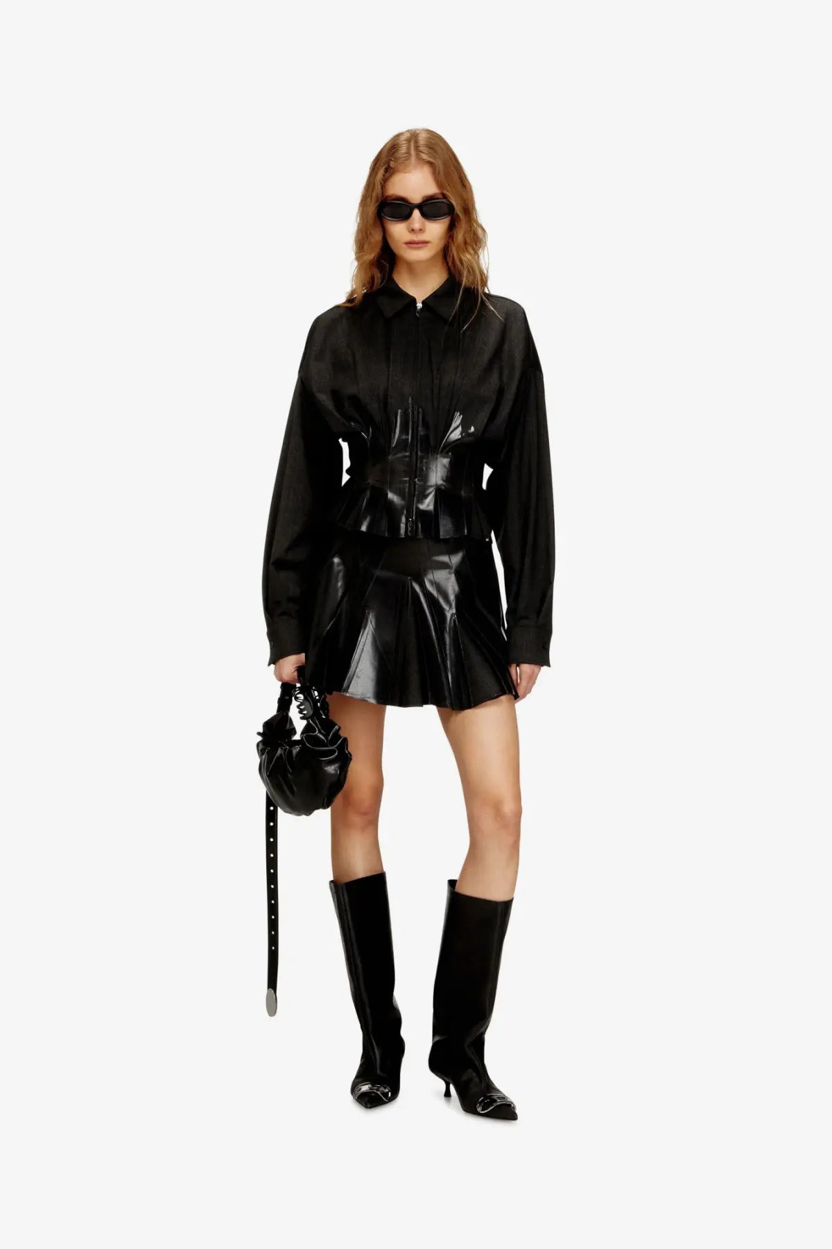 Diesel women’s black patent leather mini skirt with structured pleats and high-waisted silhouette in virgin wool blend