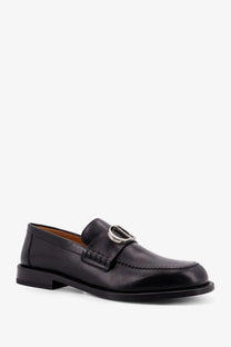 Dior men’s archie black leather loafer with silver-toned circular buckle and stitched detailing front view