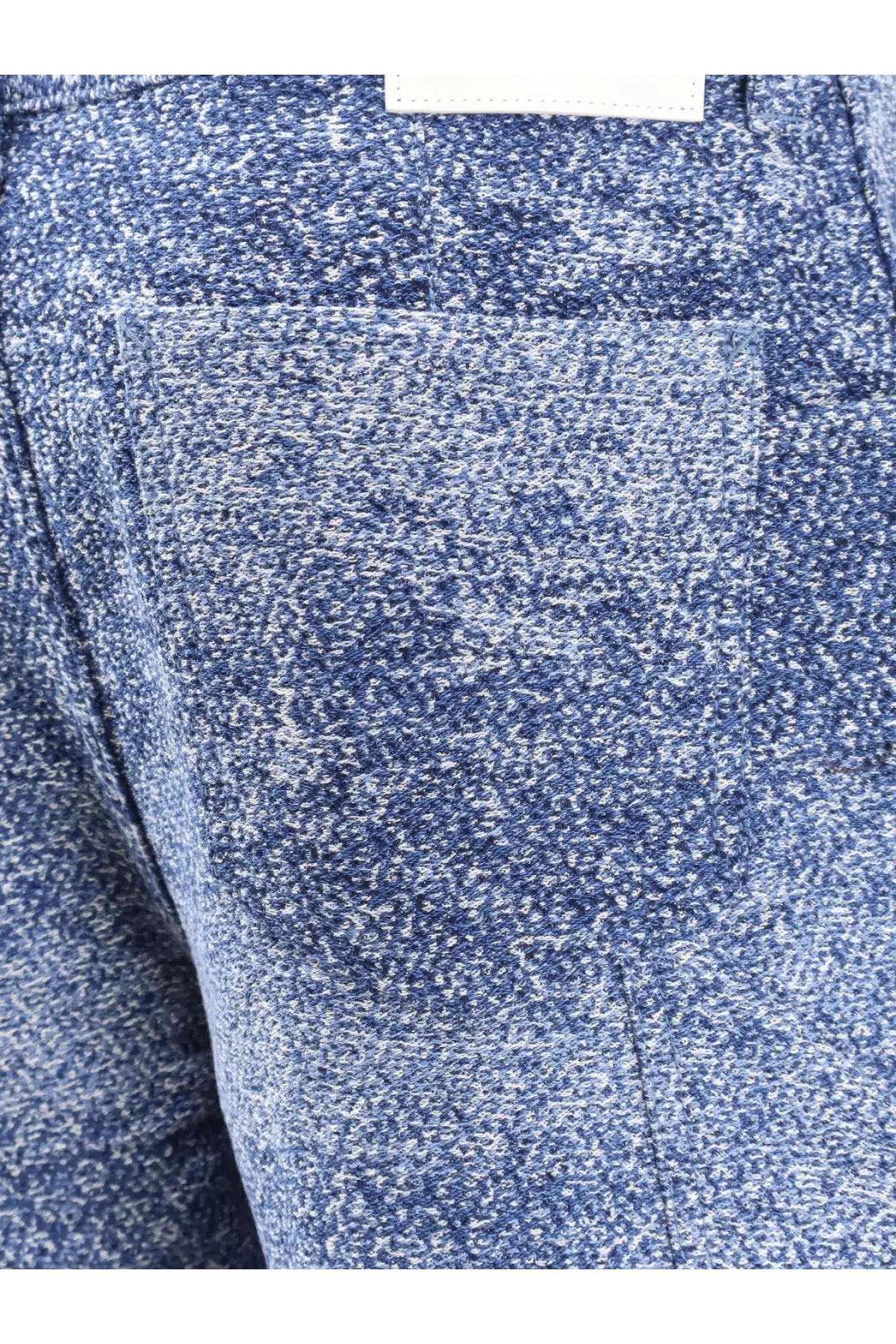 Dior men’s carpenter jacquard jeans in blue with white speckled textured fabric and visible front pocket