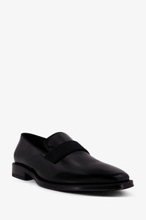 Dior men’s palmarè black patent leather loafer with a sleek minimalist design and contrasting black elastic strap