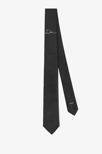 Black Dior men’s silk tie featuring a subtle white embroidered logo near the top and a printed brand name at the tip