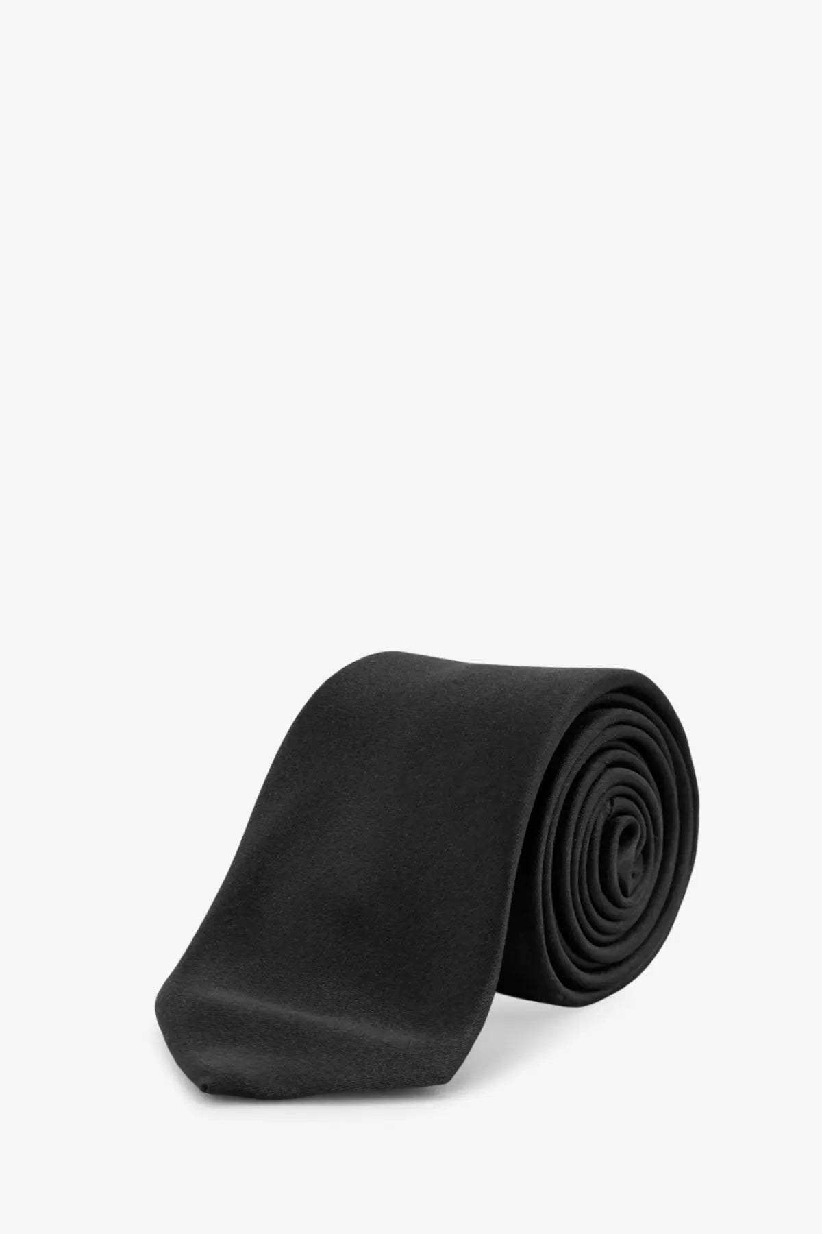 Neatly rolled dior men’s silk tie in black displayed against a plain background
