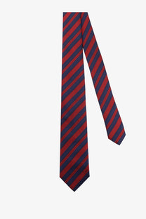 A sleek red and navy blue diagonally striped silk tie with subtle sheen from Dior men’s silk tie blue collection