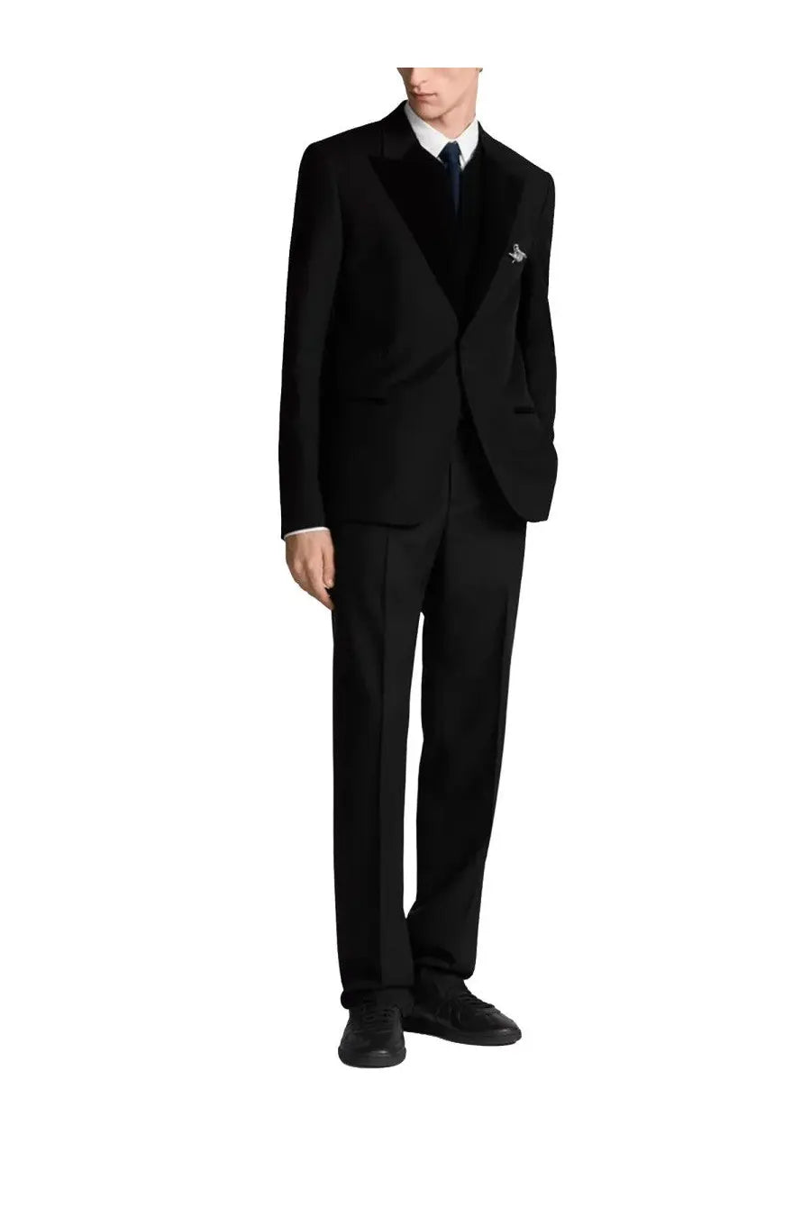 Black wool Dior men’s blazer with notched lapels and subtle embroidered pin on left breast for formal wear