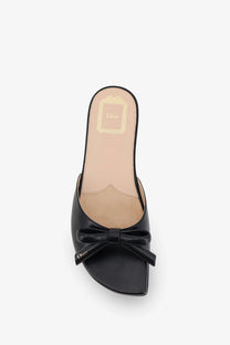Black leather Dior women’s mule sandal featuring a bow detail at the front for elegant wear