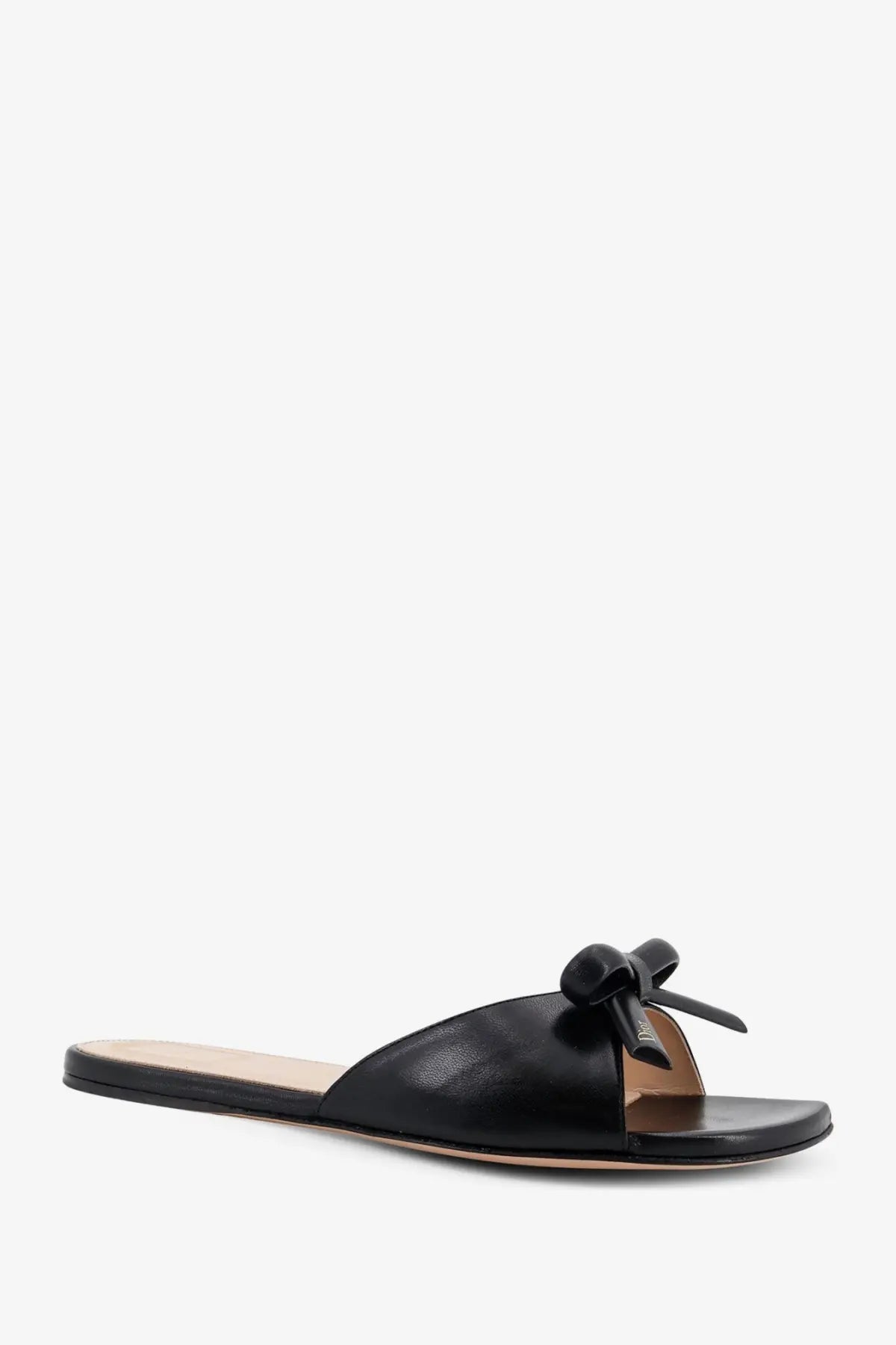 Black leather slide sandal for women featuring a small bow detail on the strap by Dior