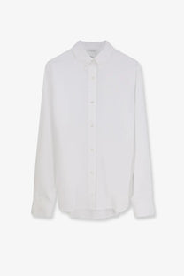 A crisp white Dior women’s cotton popelin shirt with classic collar and long sleeves made from lightweight fabric