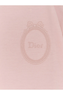 A delicate pink dior women’s cotton shirt with an embroidered oval logo bow and brand name in fine threadwork