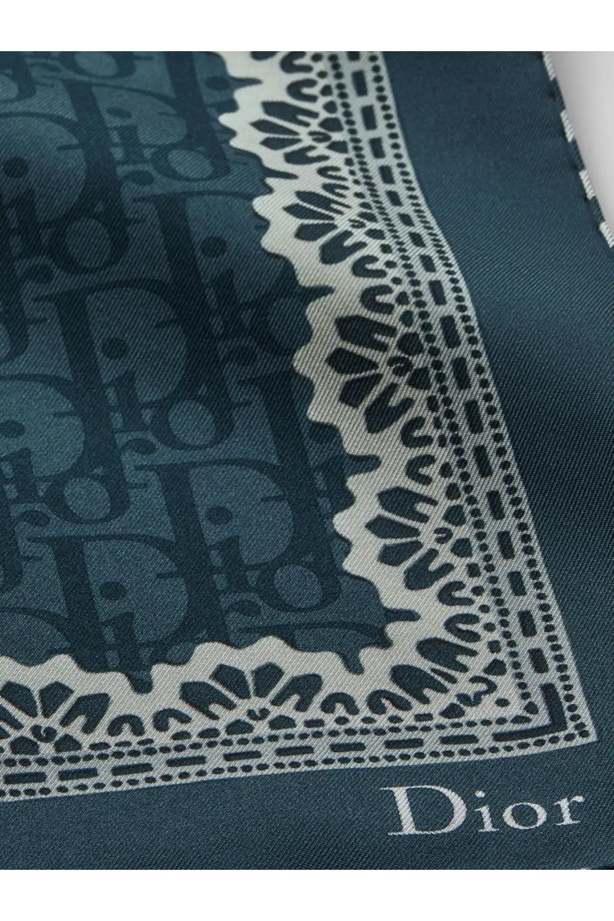 Dior women’s deep teal silk scarf with repeating monogram pattern and ornate white lace border in blue tone