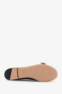 Dior women’s Jadior black leather flat sandal with tan insole and metallic bow detail