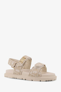 Beige Dior lurex flat sandal featuring a textured pattern and gold-tone Dior logo detailing for women