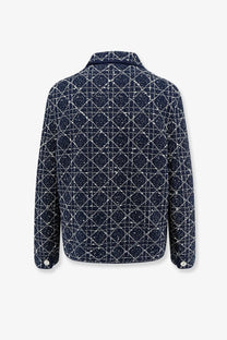 Dark blue tweed Dior women’s Macrocannage blazer with geometric white diamond pattern and silver buttons