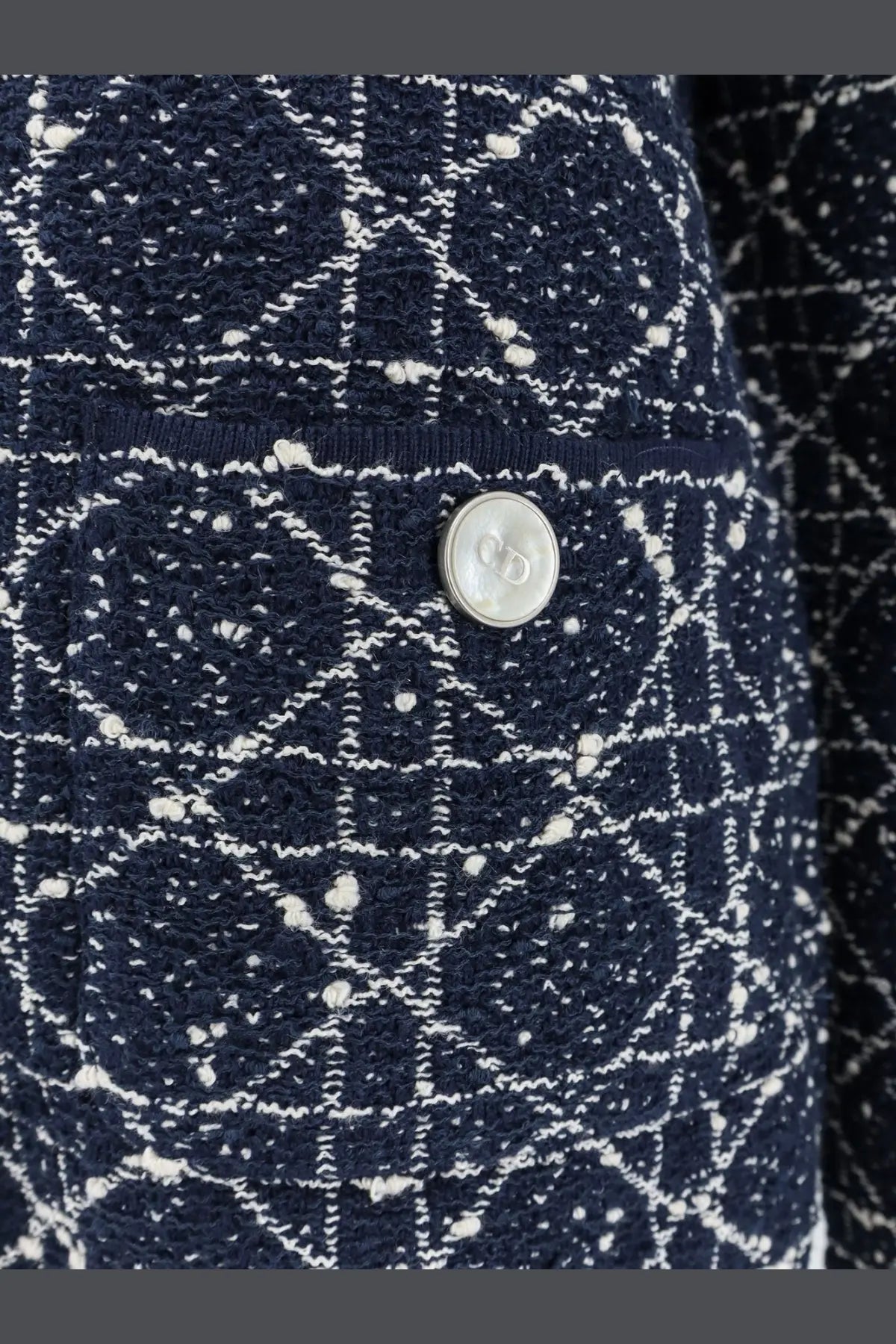 Dior women’s navy blue and white tweed blazer with geometric pattern and silver Dior logo button