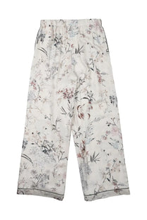 Cream-colored satin dior women’s pantalone in seta stampata white with delicate pink gray and black floral and bird print