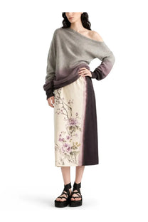 Dior women’s printed midi skirt white paired with a soft off-the-shoulder gray gradient sweater with a relaxed fit