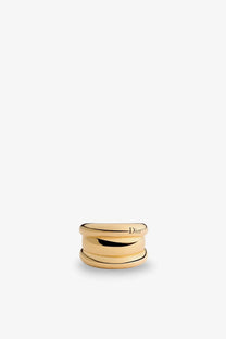 Dior women’s rocks metal ring in gold with a sleek stacked design featuring three interlocking bands
