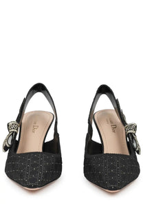 Dior women’s black slingback pumps with subtle textured pattern and decorative bow accents