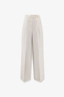 Cream-colored high-waisted wide-leg tailored virgin wool trousers for women by Dior in beige