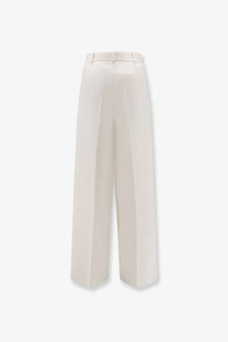 Dior women’s beige virgin wool trousers with cream-colored wide-leg, tailored design, and subtle front pleats