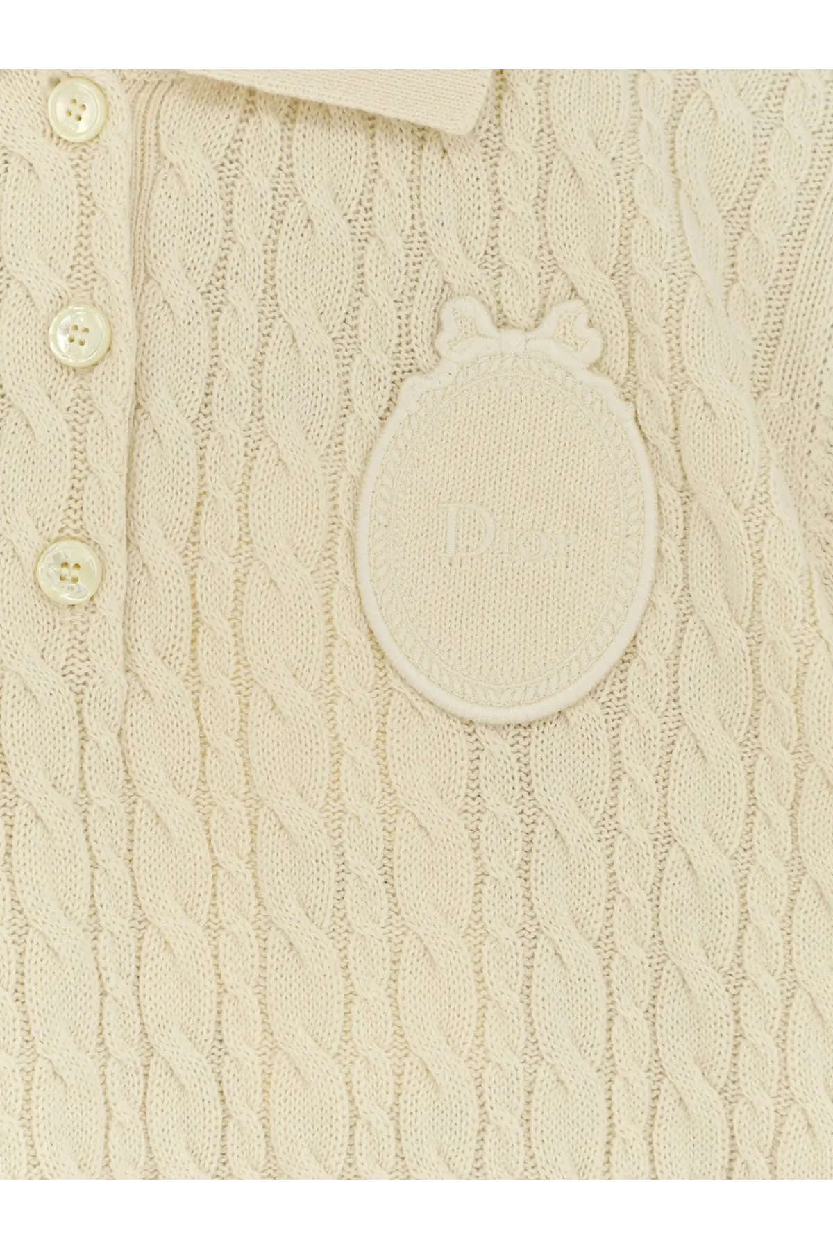 Dior women’s cream-colored cable-knit wool and cotton blend polo sweater with embroidered logo patch and white buttons