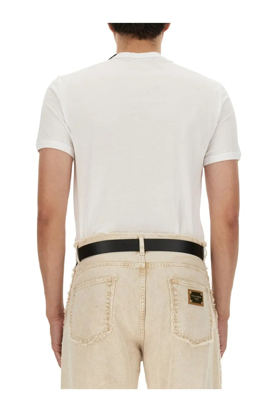 Back side of cream-colored distressed denim jeans with black belt and gold-tone patch for dolce &amp; gabbana bee shirt