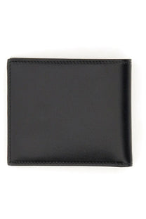 Dolce &amp; Gabbana men’s bifold wallet in black leather with precise stitching along the edges