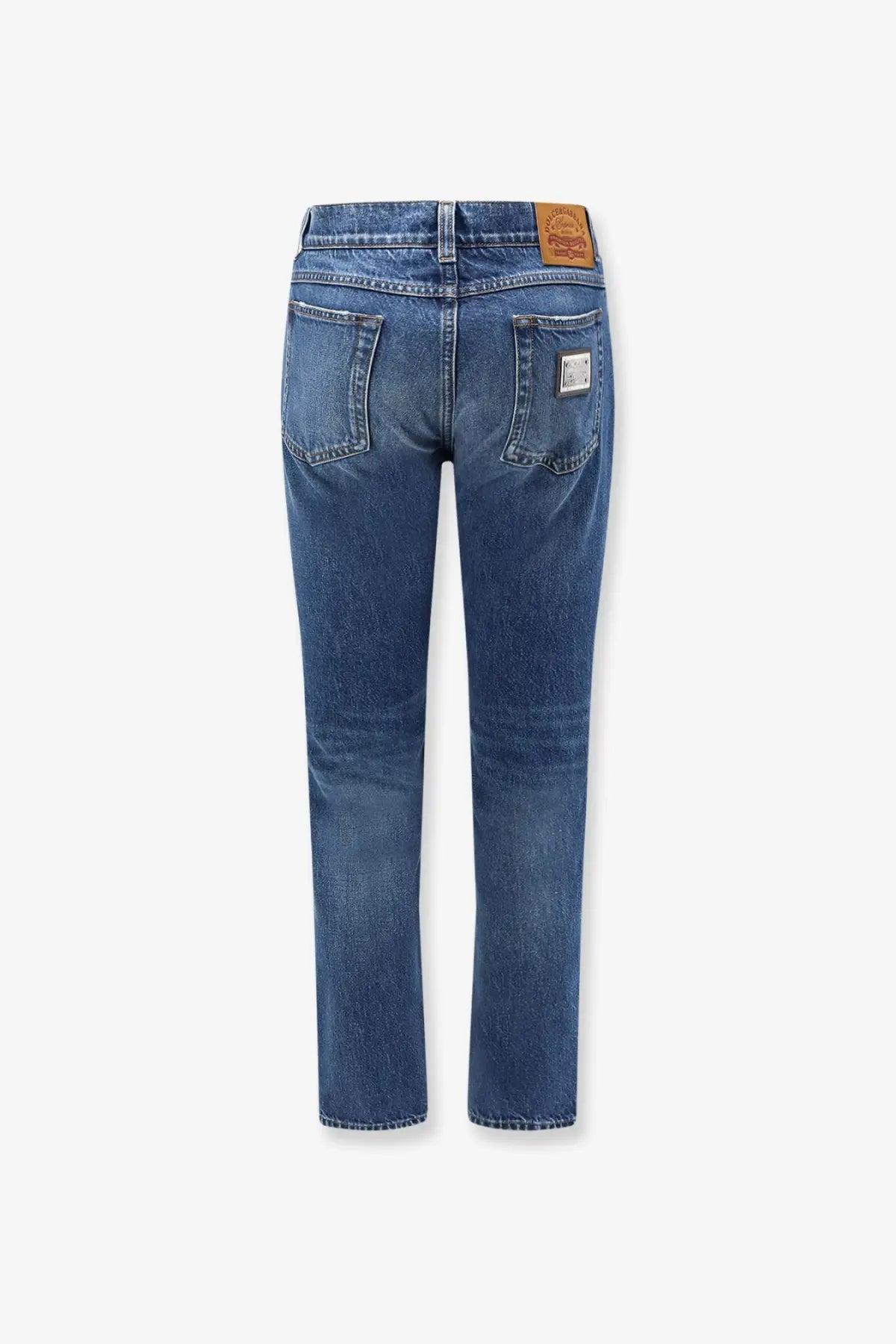 Dolce &amp; Gabbana men’s blue denim jeans with faded wash five-pocket design and brown leather brand patch on back waistband