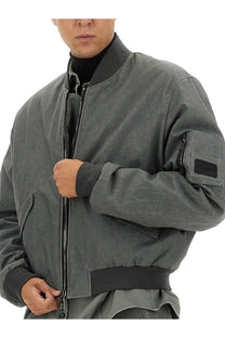 Dolce &amp; Gabbana men’s dark gray bomber jacket with matte finish black zipper accents and subtle textured pattern