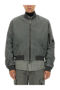 Dolce and gabbana men’s gray bomber jacket with black trim and zipper details over grey background