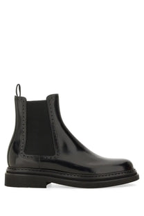 Dolce &amp; Gabbana men’s black patent leather chelsea boot with decorative brogue detailing and rubber sole