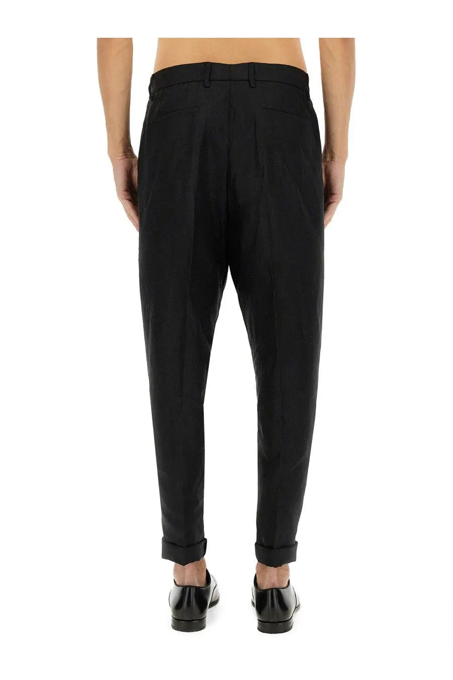 Dolce &amp; Gabbana men’s black canvas slim-fit tailored trousers with subtle pleats at the back shown from behind