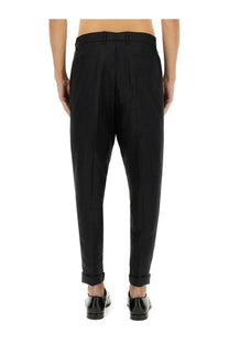 Dolce &amp; Gabbana men’s black canvas slim-fit tailored trousers with subtle pleats at the back shown from behind