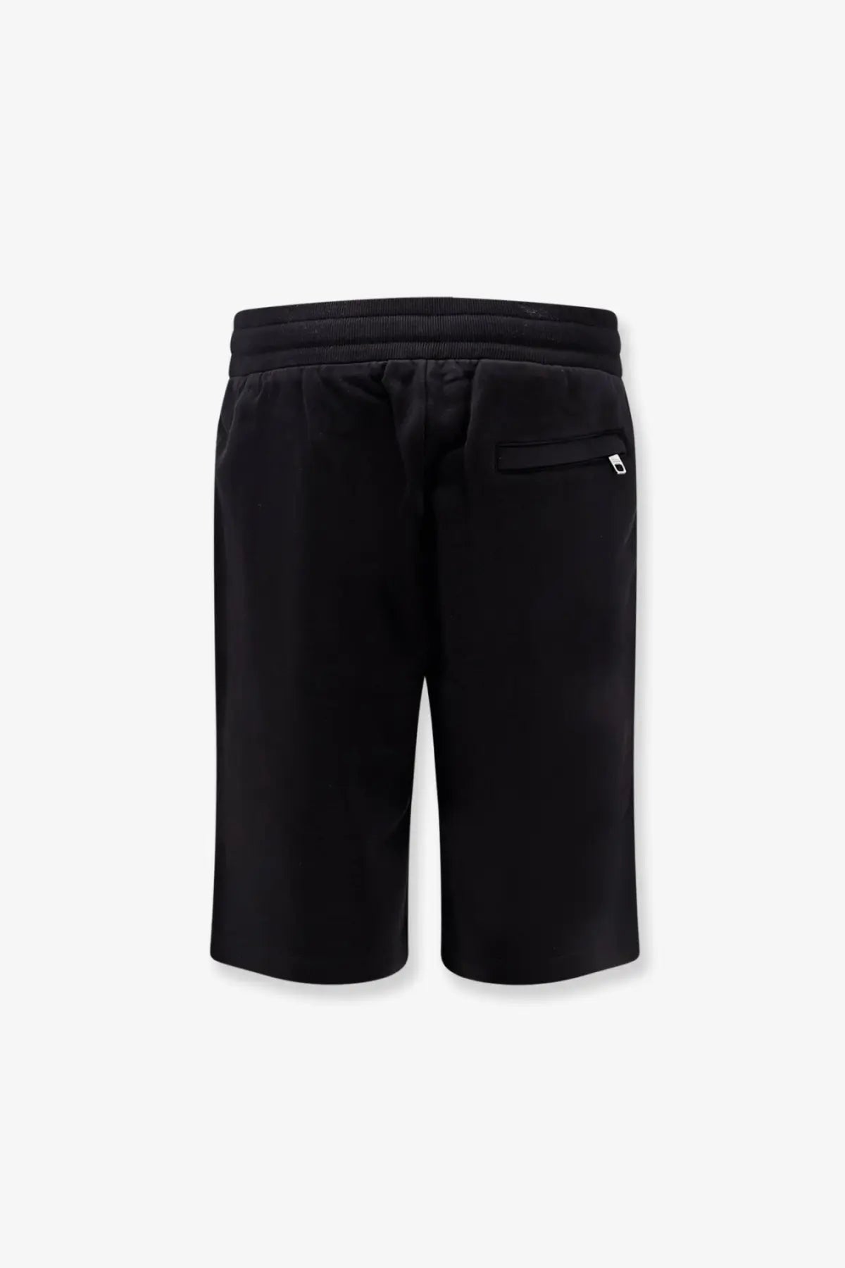 Back view of dolce &amp; gabbana men’s black cotton athletic bermuda shorts with drawstring waistband and white logo on pocket