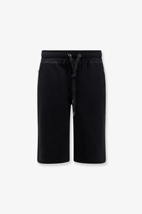 Dolce &amp; Gabbana men’s black cotton Bermuda shorts featuring a drawstring waistband and subtle side pockets