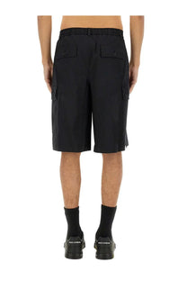 Dolce &amp; Gabbana men’s black cotton cargo bermuda shorts featuring side pockets and buttoned flap details