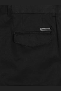 Back view of dolce &amp; gabbana men’s black cotton gabardine trousers with sleek design and metallic brand tag on pocket