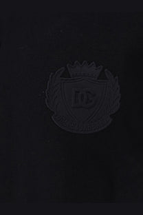 Black dc shoes logo patch with crown and shield on dolce and gabbana men’s black cotton polo shirt