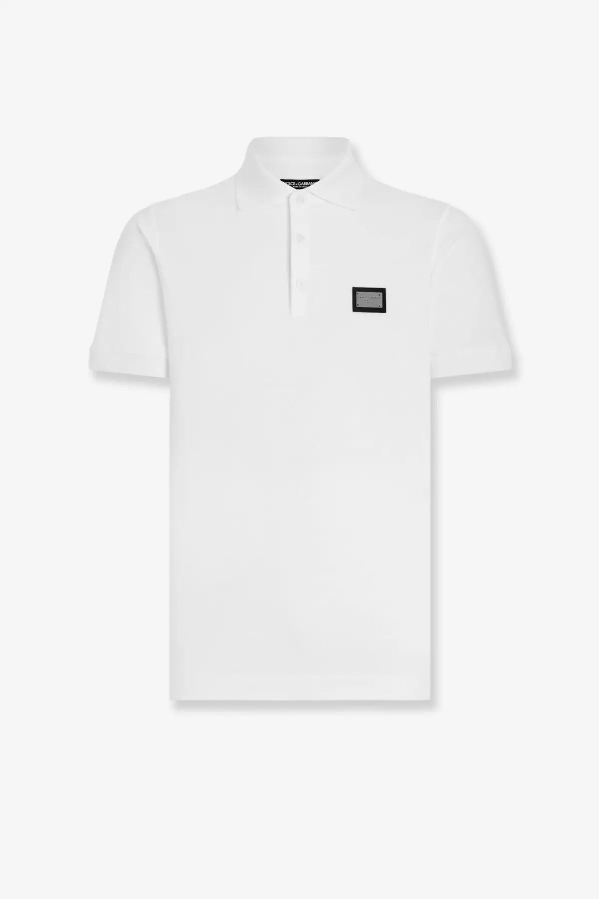 Dolce &amp; Gabbana men’s white cotton polo shirt with black rectangular chest patch and small brand tag at the collar