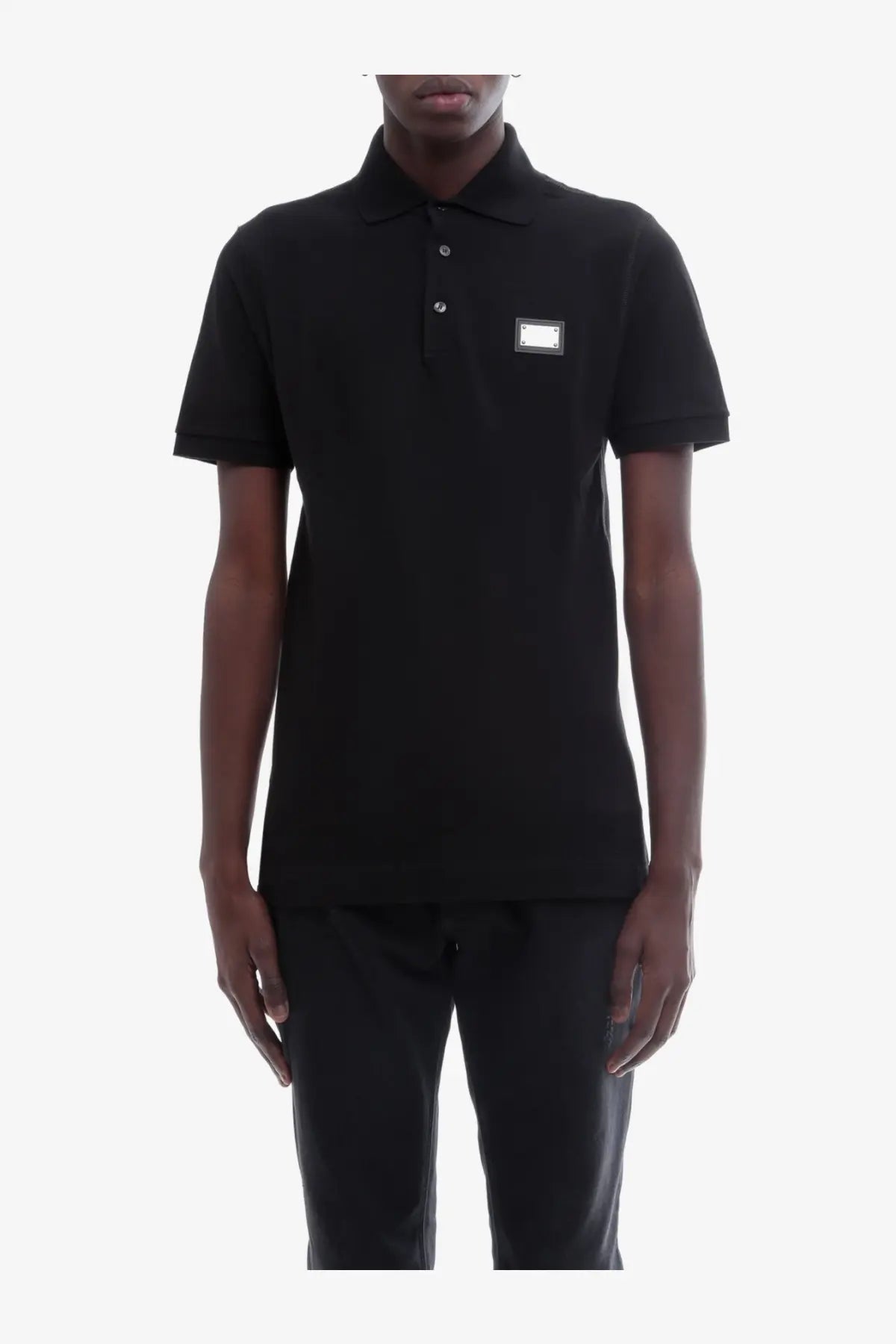 Dolce &amp; Gabbana men’s black cotton short-sleeved polo shirt with silver rectangular logo patch on left chest